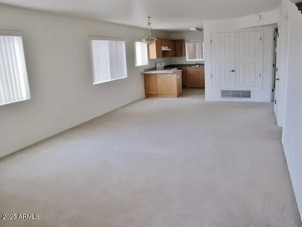 a kitchen with stainless steel appliances kitchen island a sink a stove and window