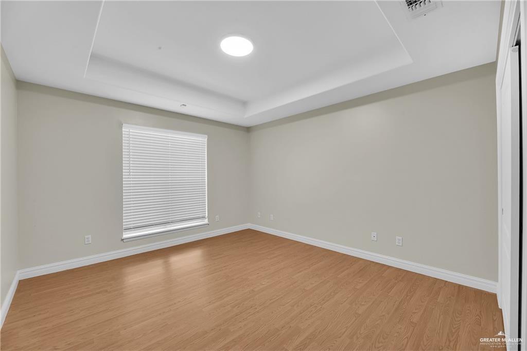 321 Condor Avenue McAllen, TX 78504 - Photo 11 of 25 an empty room with a empty space and window
