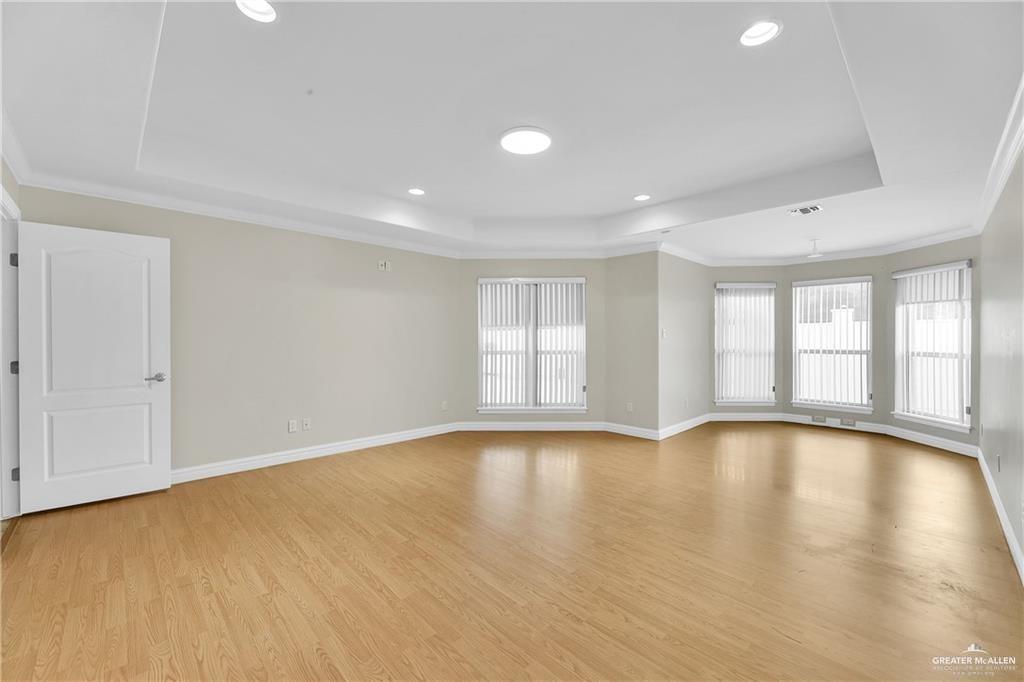 321 Condor Avenue McAllen, TX 78504 - Photo 15 of 25 a view of empty room with wooden floor and fan