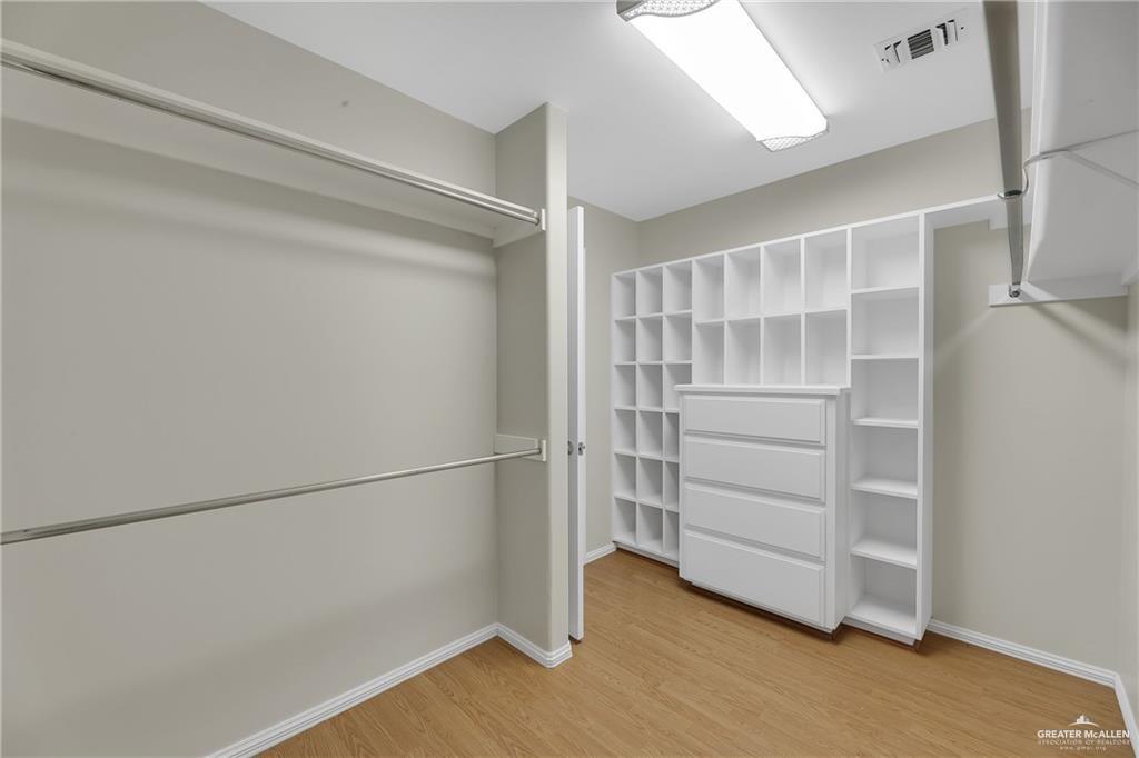 321 Condor Avenue McAllen, TX 78504 - Photo 19 of 25 a view of walk in closet with empty racks