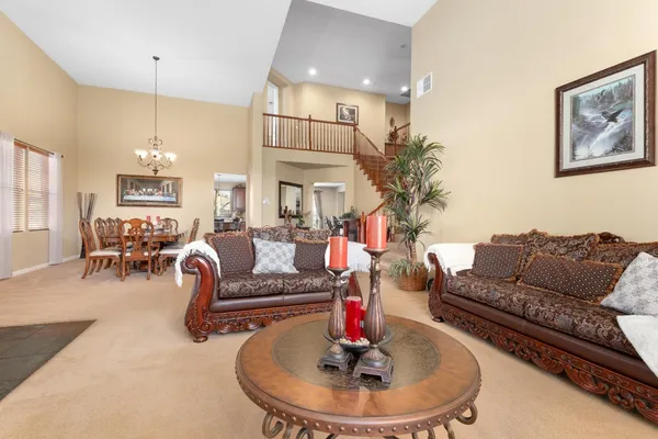 a kitchen with stainless steel appliances granite countertop a sink and a refrigerator