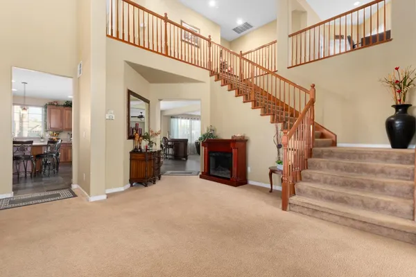 a kitchen with a table chairs sink and cabinets