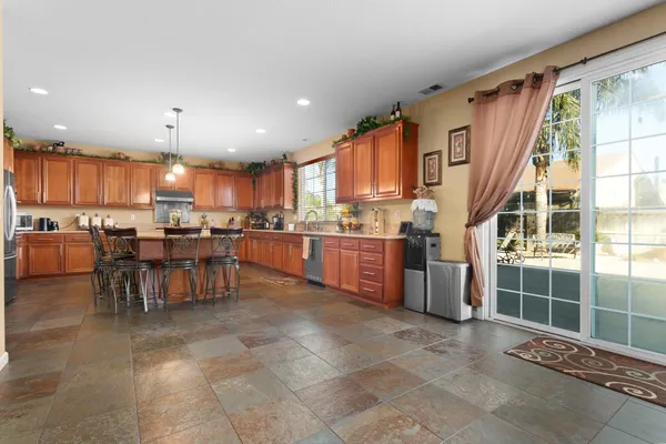 a view of a livingroom with furniture and a ceiling fan
