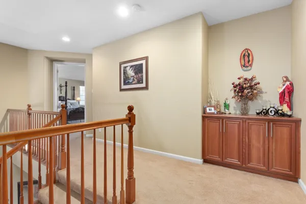 a spacious bathroom with double vanity and a large mirror