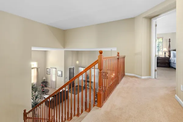 a spacious bathroom with a tub sink and mirror