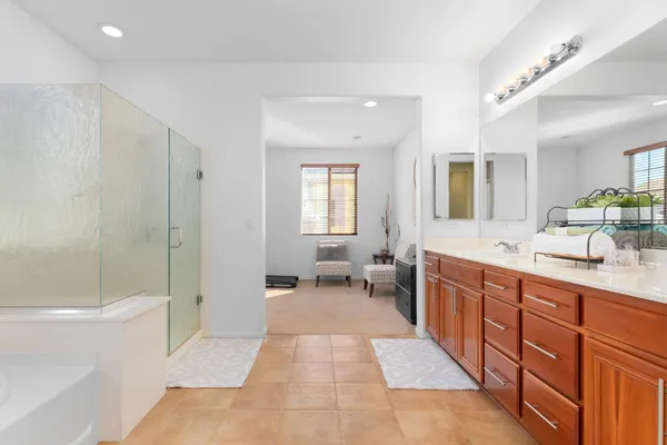 a spacious bedroom with a bed and a couch