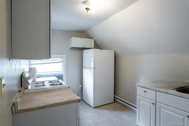 a bedroom with bed and a window