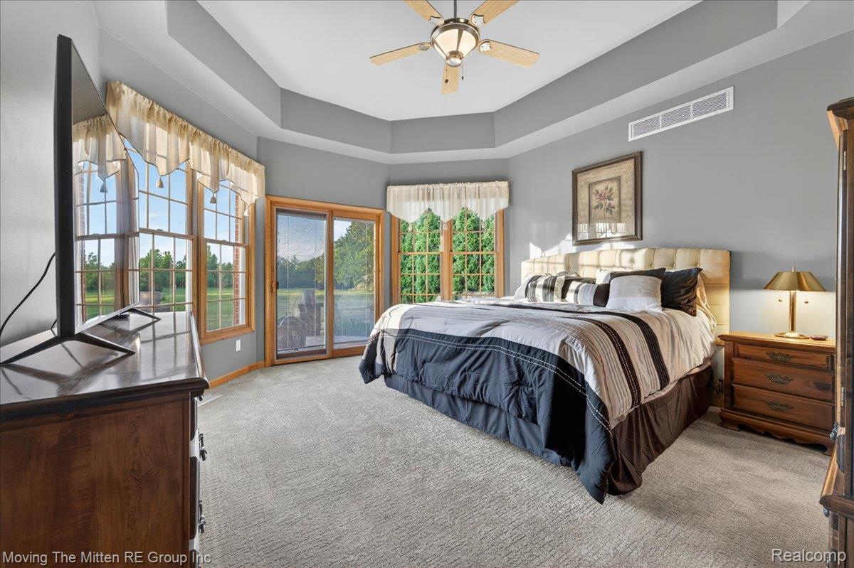 39750 Willow Road New Boston, MI 48164 - Photo 24 of 68 Recessed tray ceiling with a built-in ceiling fan and light fixture