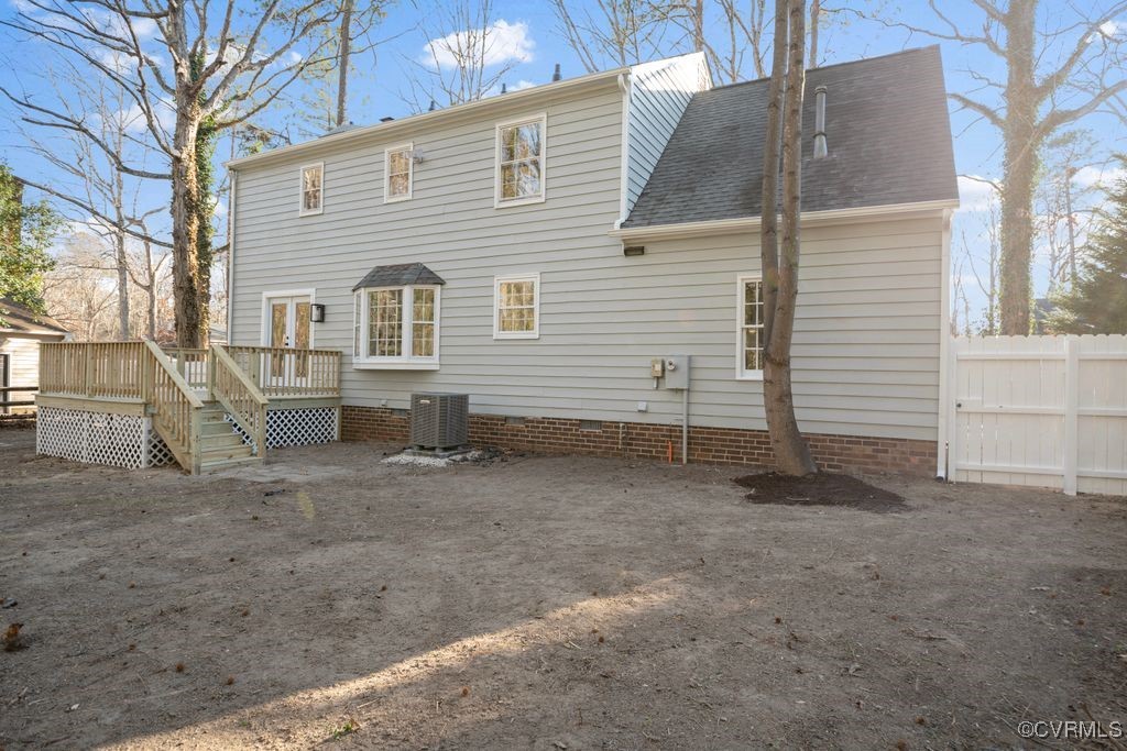 13906 2 Notch Road Midlothian, VA 23112 - Photo 36 of 39 Back of property with a wooden deck and central AC