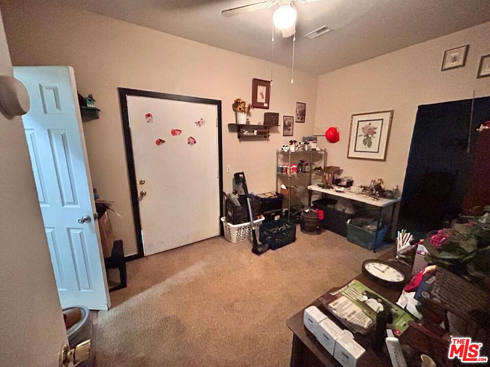 5307 El Rio Avenue Riverside, CA 92509 - Photo 14 of 20 a room with furniture and a flat screen tv