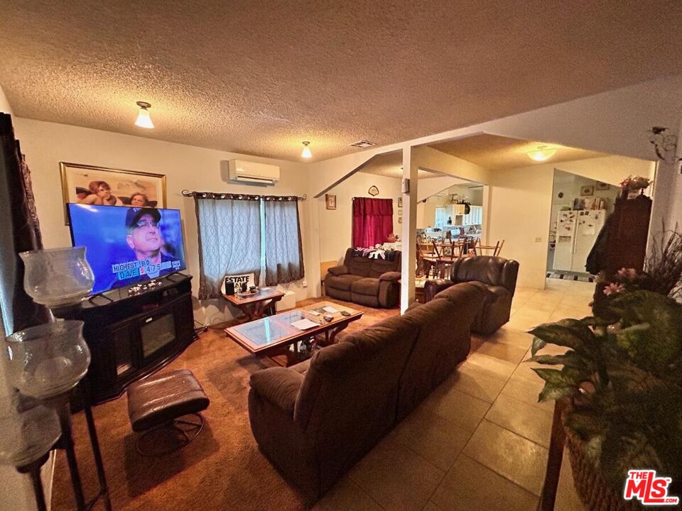 5307 El Rio Avenue Riverside, CA 92509 - Photo 20 of 20 a living room with furniture and a flat screen tv