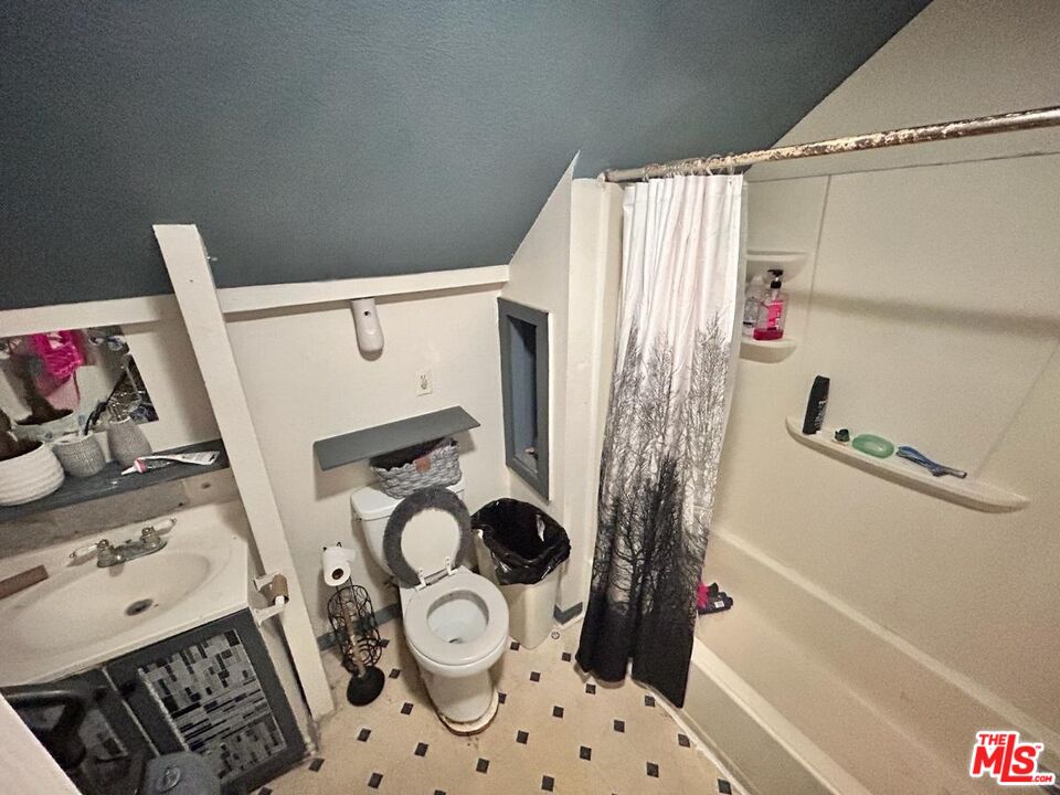 5307 El Rio Avenue Riverside, CA 92509 - Photo 6 of 20 a bathroom with a sink and a shower