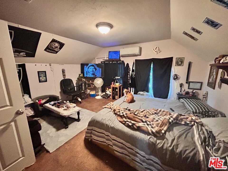 5307 El Rio Avenue Riverside, CA 92509 - Photo 8 of 20 a bedroom with furniture and a bed