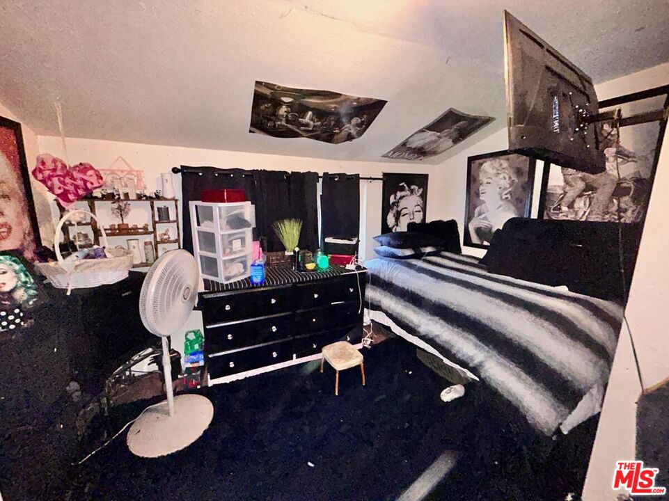 5307 El Rio Avenue Riverside, CA 92509 - Photo 9 of 20 a living room with furniture and a flat screen tv
