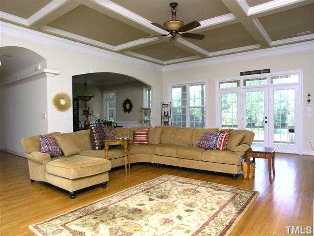 7044 Wildlife Trail Raleigh, NC 27613 - Photo 4 of 25 a living room with furniture and a large window
