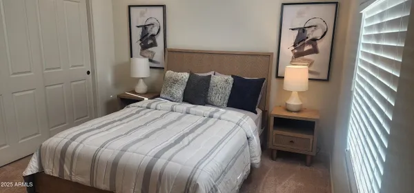 a bathroom with a sink a toilet and shower curtain