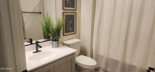 a view of a room with furniture and wooden floor