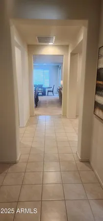 a view of a hallway to a bedroom