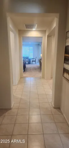 a view of a hallway to a bedroom