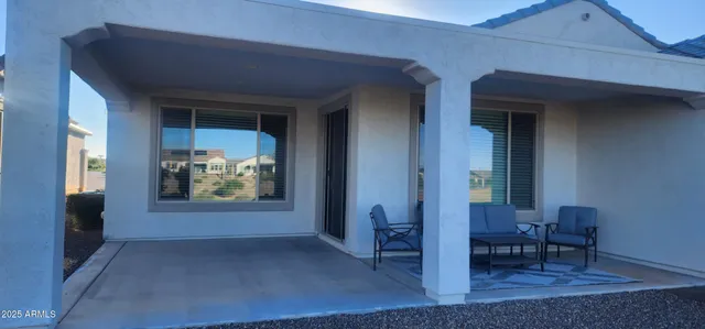a view of an outdoor dining space with a patio