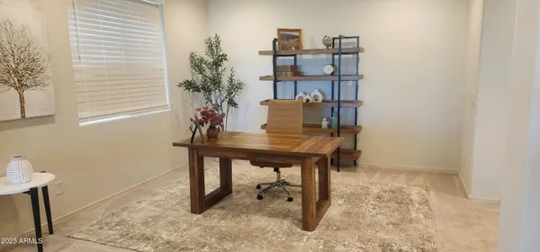 a view of a workspace with furniture