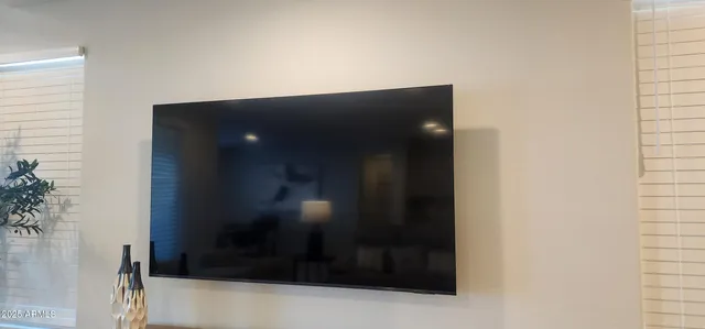 a kitchen with granite countertop stainless steel appliances a sink and a refrigerator