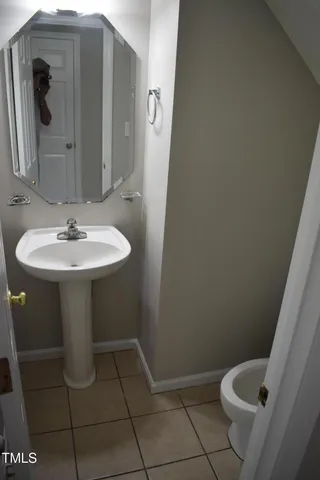 a bathroom with a sink and mirror