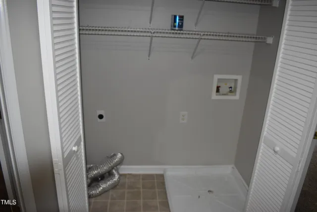 a bathroom with a shower and toilet