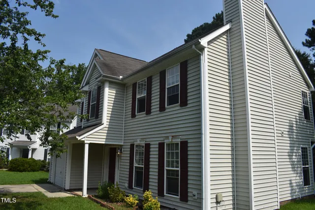 a front view of a house with yard