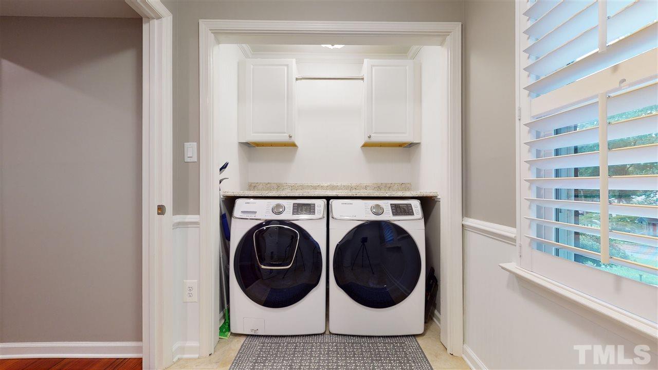 6105 Ivy Ridge Road Raleigh, NC 27612 - Photo 17 of 27 a view of utility room with washer and dryer