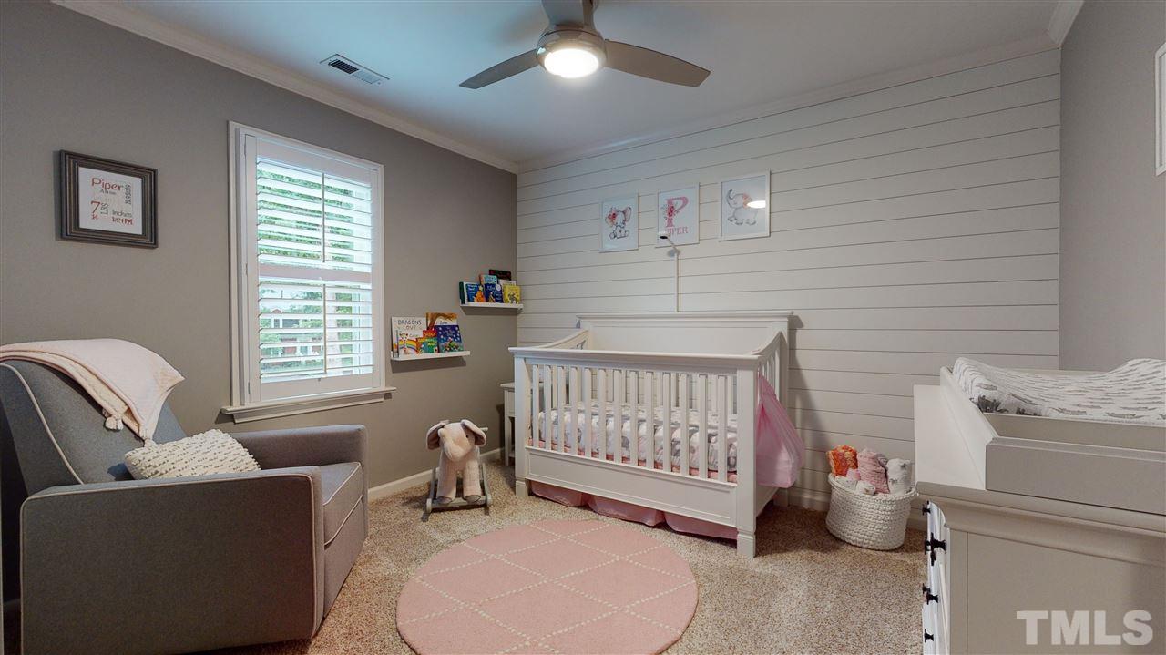 6105 Ivy Ridge Road Raleigh, NC 27612 - Photo 22 of 27 a bedroom with furniture and a window