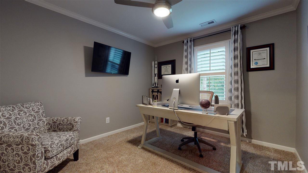 6105 Ivy Ridge Road Raleigh, NC 27612 - Photo 23 of 27 a workspace with furniture and a window