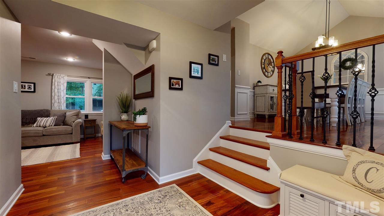 6105 Ivy Ridge Road Raleigh, NC 27612 - Photo 5 of 27 a livingroom with furniture staircase and a floor to ceiling window
