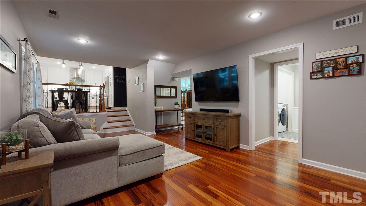 6105 Ivy Ridge Road Raleigh, NC 27612 - Photo 6 of 27 a living room with furniture and a flat screen tv