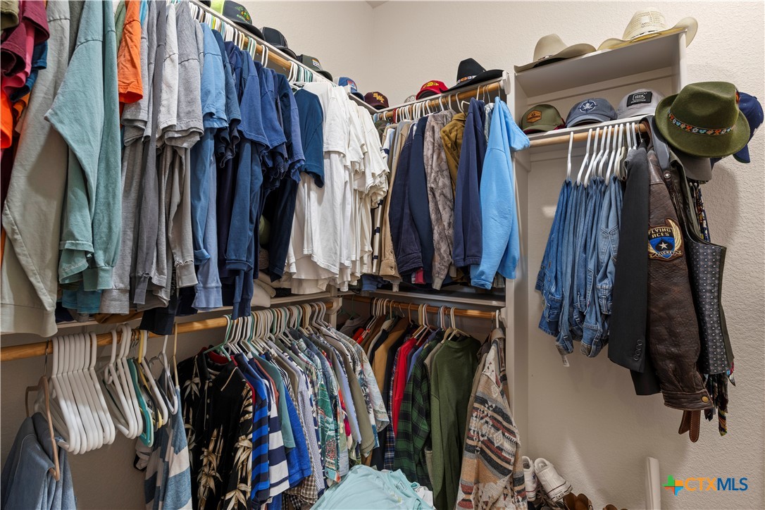 2649 Bowles Ranch Road Belton, TX 76513 - Photo 21 of 36 a view of walk in closet with clothes