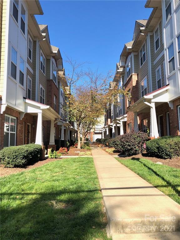 626 Raya Court Charlotte, NC 28204 - Photo 11 of 14 a view of a building with a yard