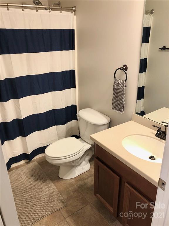 626 Raya Court Charlotte, NC 28204 - Photo 14 of 14 a bathroom with a toilet a sink and mirror