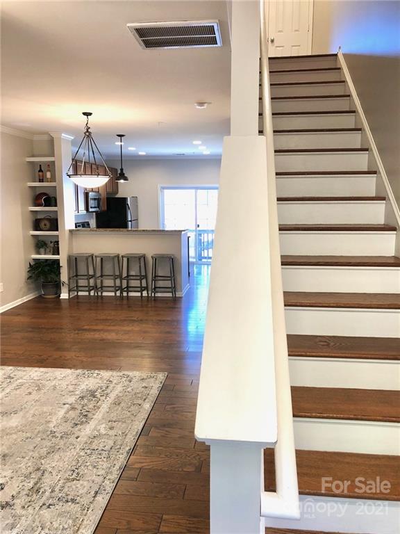626 Raya Court Charlotte, NC 28204 - Photo 6 of 14 a view of entryway and hall with wooden floor