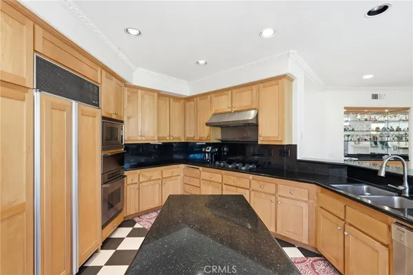 a large kitchen with a large window