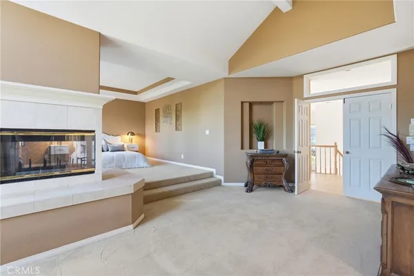 a view of a livingroom with furniture and a flat screen tv