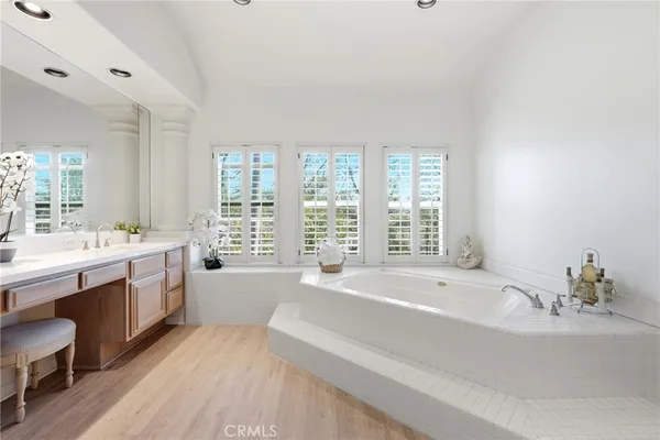 a spacious bathroom with sink shower and bathtub