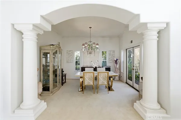 a view of a dining room with furniture and window