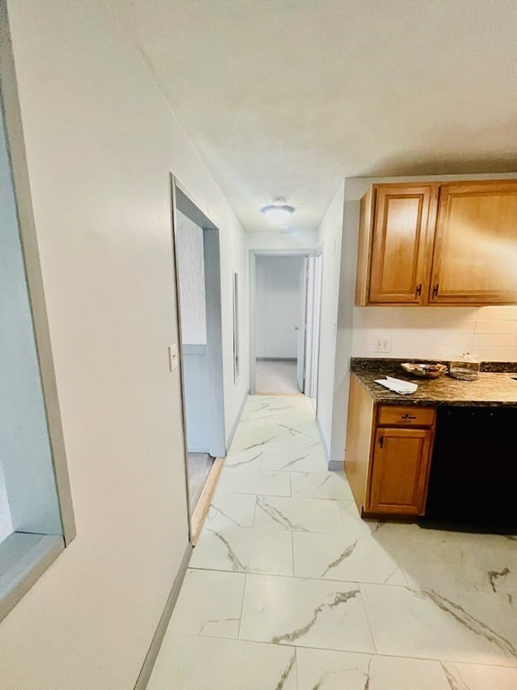 15 Spencer Road, Unit 26E Boxborough, MA 01719 - Photo 3 of 27 a view of a kitchen with refrigerator and wooden floor