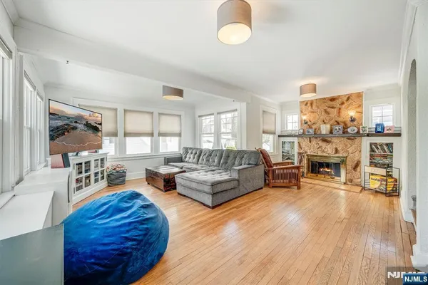 a living room with furniture and a fireplace