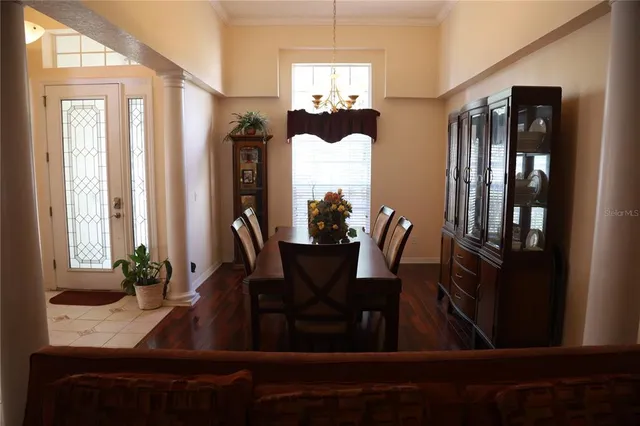 a view of a dining room with furniture and window