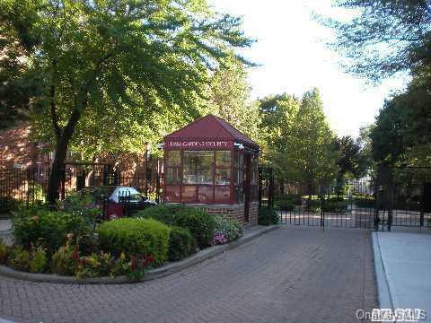 150-29 72nd Road, Unit 5E Queens, NY 11367 - Photo 1 of 1 a group of people sitting in a park with large trees