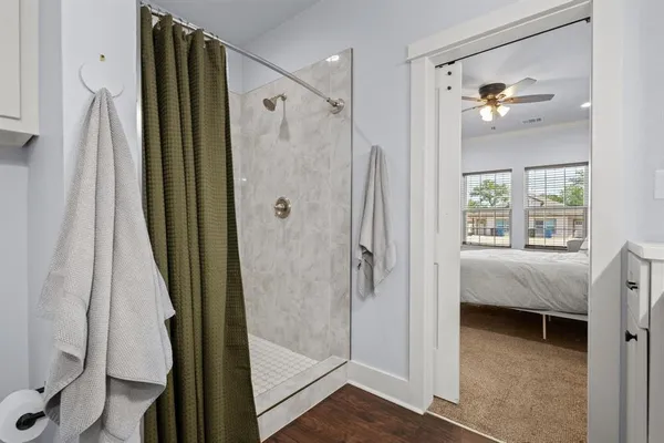 a bathroom with a shower and a tub