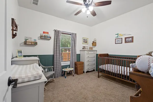 a bedroom with furniture and a window