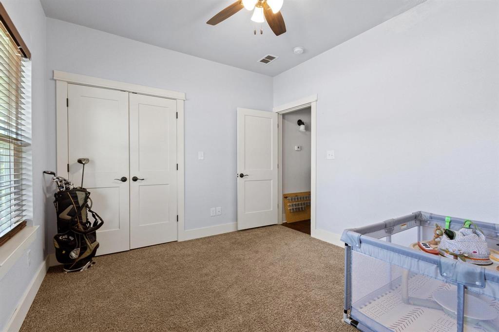 610 West Elm Street Denison, TX 75020 - Photo 20 of 26 a view of a livingroom with storage