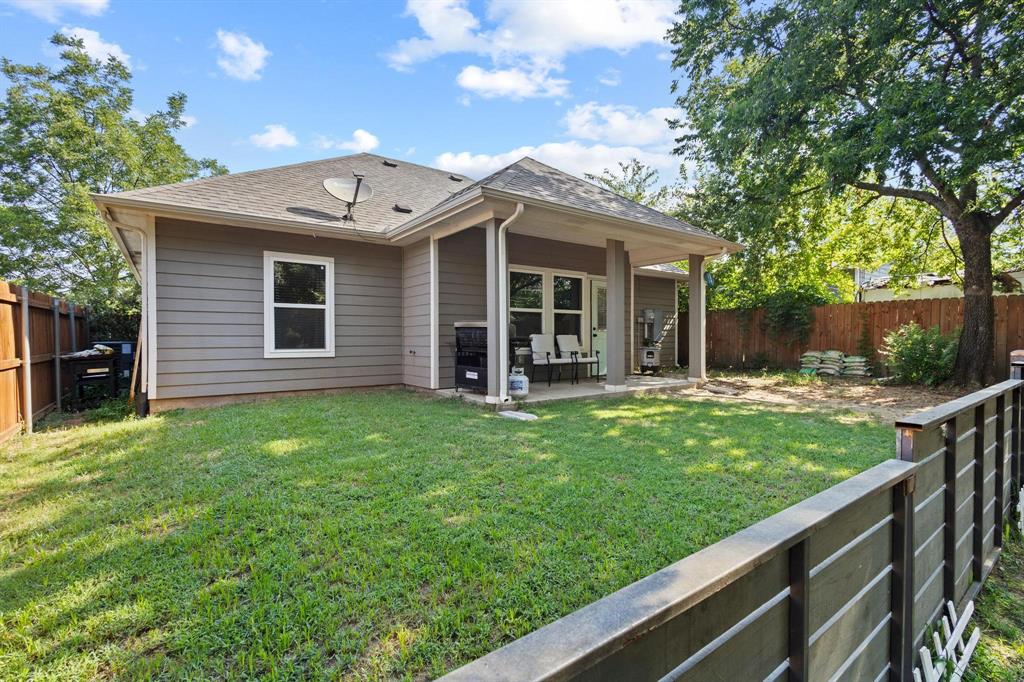 610 West Elm Street Denison, TX 75020 - Photo 24 of 26 a view of a house with backyard and porch